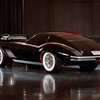In these photos the car has wire wheels, red pin striping and louvers in the front fenders. Note the dashboard is also displayed