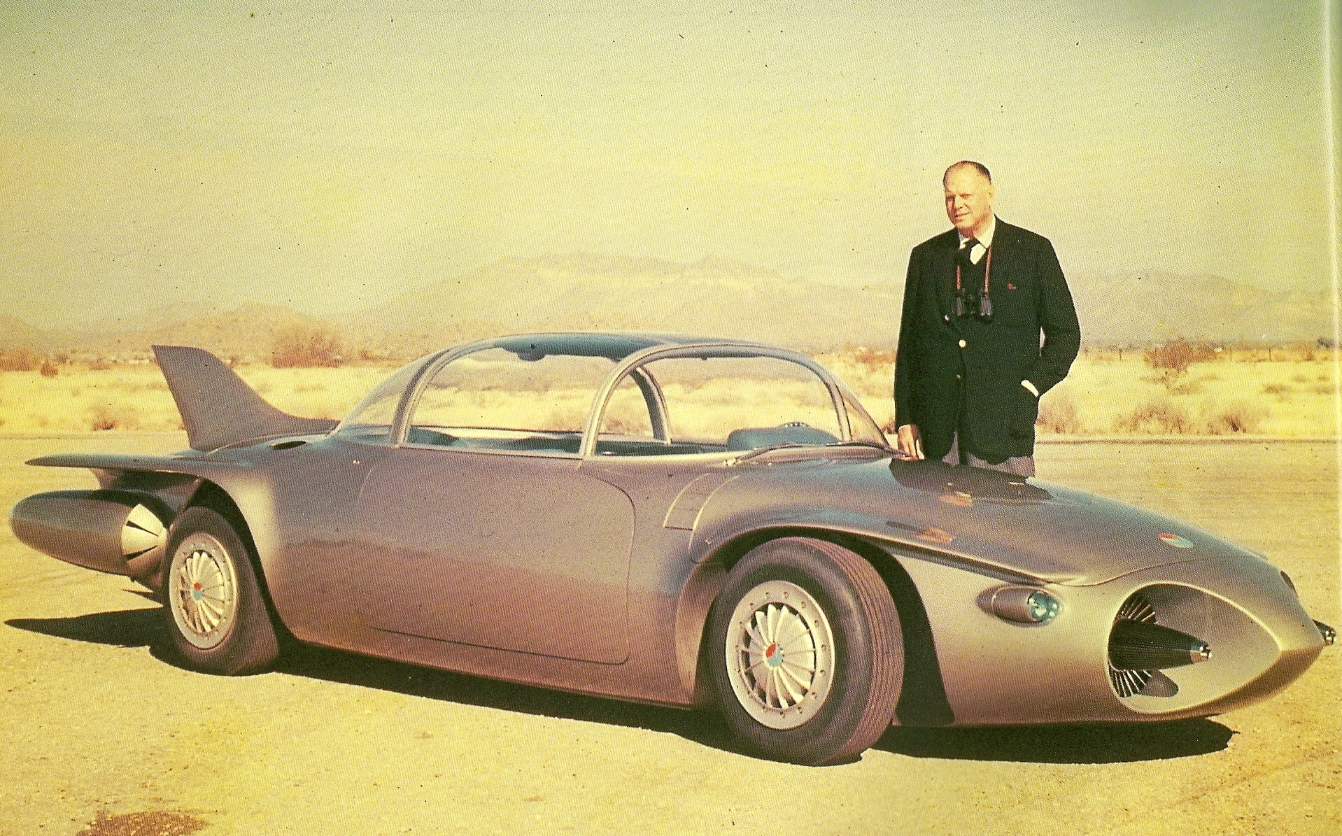 Harley Earl poses with the Firebird II