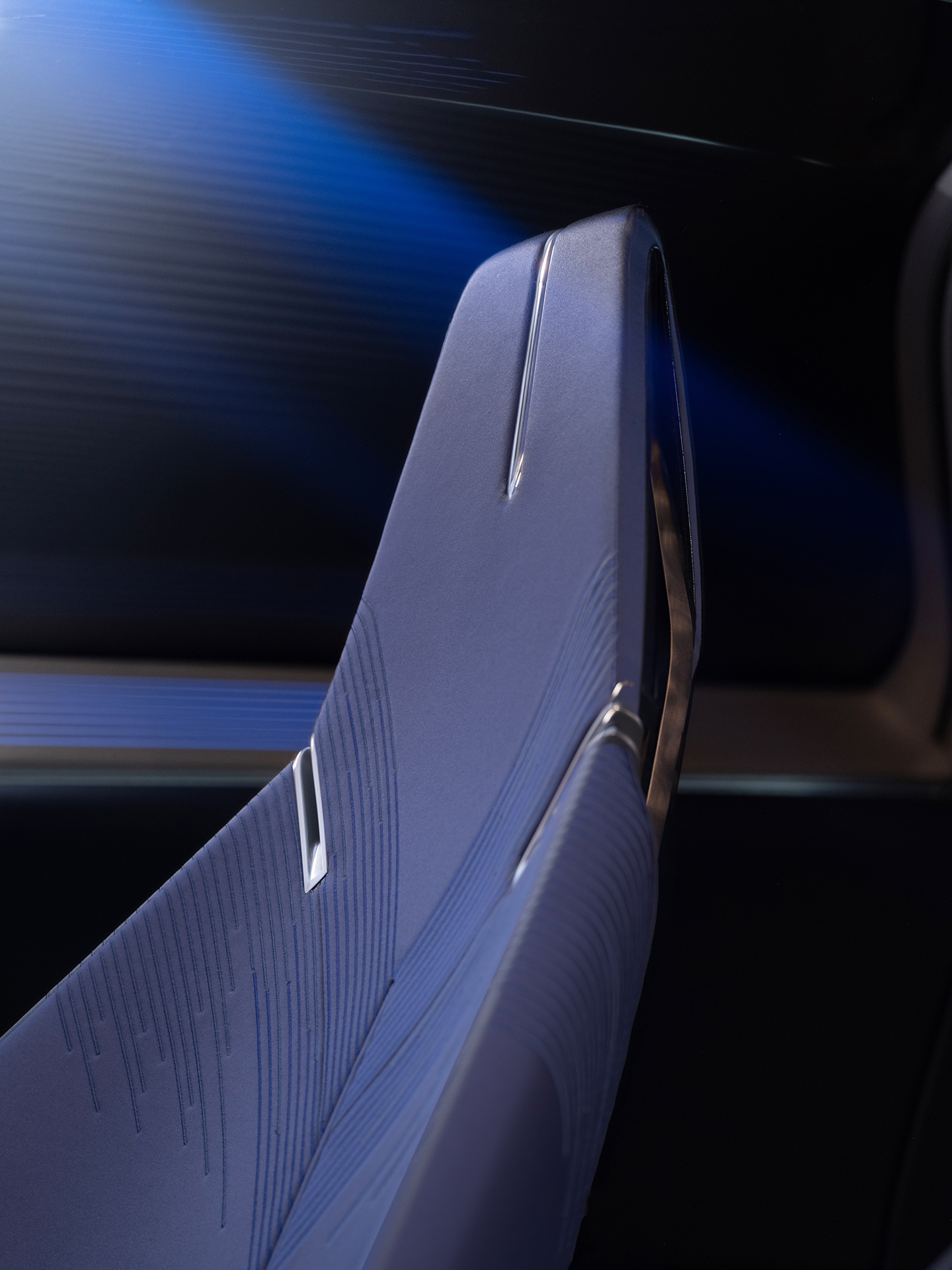 Close-up view of Opulent Velocity seat in two-tone Selene Metallic dark blue interior color.